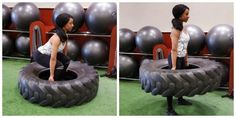 a woman standing on top of a giant tire