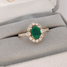 Green emerald in 14k yellow gold with natural earth-mined round and pear diamond accents.  This ring has a pronged basket and a diamond studded shank. A beautiful ring design perfect for an eye catching engagement or anniversary. This ring also makes a beautiful birthstone ring for your loved ones.  The occasions to show off this ring are endless - mother's day, graduation, wedding, birthday, date night, Christmas, etc. :)   Specifications: Item Type: Ring Gold Purity: 14k Gold weight: 2.56 grams Diamond: 24 diamonds totaling 0.61cts Stone Specs: Stone: Emerald Stone Weight: 1.25cts Shape: Oval Size: 8x6 mm Treatment: Oiled Hardness: 7.5-8 Cut: Faceted This ring is made with solid 14k gold and natural earth mined SI G/H diamonds.  Interested in just the ring setting? Here is link :  etsy.c Emerald Green Ring, Cottagecore Wedding, Colorful Rings, Green Sapphire Engagement, Birthday Date, Designer Silver Jewellery, Green Gemstone Ring, Night Christmas, Future Engagement Rings