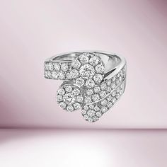 Introducing our exquisite Ready to Ship 3 Diamond Round Cut Contrarie Cluster Illusion Ring, a remarkable piece of jewelry that epitomizes elegance and Italian craftsmanship. The unique arrangement of diamonds creates the illusion of larger center stones, surrounded by smaller diamonds, adding depth and brilliance to the ring's appearance. Crafted in luxurious 18K gold, the ring's band complements the diamonds perfectly, providing a touch of sophistication and durability. Made in Italy, this rin Luxury Brilliant Cut Cluster Ring, Luxury Cluster Ring With Prong Setting, Elegant Gia Certified Cubic Zirconia Cluster Ring, Luxury Cluster Cut Diamond Ring, Elegant Cubic Zirconia Cluster Ring Gia Certified, Elegant White Cluster Ring Gia Certified, Luxury Cluster Diamond Ring, Luxury Cluster-cut Diamond Ring, Gia Certified Luxury Cluster Rings