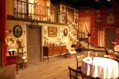 an old fashioned dining room with tables and chairs