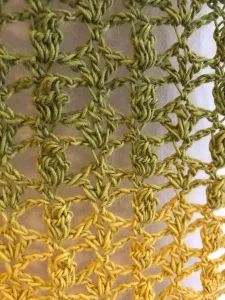 an image of crocheted fabric that is yellow and green