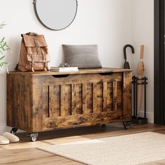 a wooden bench sitting on top of a hard wood floor next to a white wall