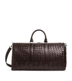 Find BOTTEGA VENETA Medium Leather Intrecciato Duffle Bag on Editorialist. Whether you employ this Bottega Veneta duffle bag to carry your gym gear or as an overnight bag for trips away, its sure to earn admiring glances and respect from other tastemakers, such is its statement-making power. The profile is instantly recognisable as Bottega Veneta thanks to the Intrecciato weave from which its crafted, while a sleek, monochrome colourway ensures timeless style. Travel Pram, Fairytale Land, Tiffany Blue Box, Bottega Veneta Bag, New Bottega, Leather Duffle Bag, Latest Bags, Leather Duffle, Gym Gear