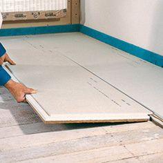 a man laying on the floor in front of an open sliding door with his feet propped up