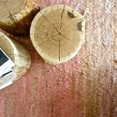 a wooden table topped with two slices of wood