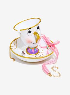 a porcelain tea cup with a pink ribbon around it's neck and face on the saucer