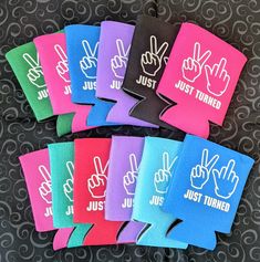 six different colored foam coasters with hand gestures on them