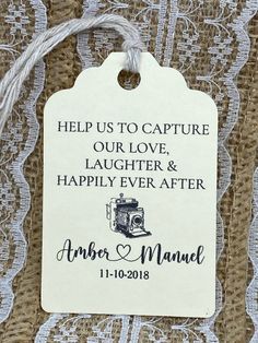 a wedding gift tag that says help us to capture our love, laughter and happily ever after