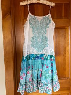 "I LOVE the colors in this Vintage Liz Claiborne slip dress. The top was a camisole before I sewed this sweet ruffled skirt on the bottom. The appliqué is also vintage (Circa early 1980's) and hand died to match the skirt. It is a size medium. Bust measures 40\" around. The waist is also 40\" around. The length is 37 inches from the armpit to the skirt bottom. There are also adjustable silk straps. This is a must have for spring and summer!" Camisole Dress With Lace Trim For Spring, Summer Dresses With Lace Patchwork And Tiered Skirt, Spring Camisole Dress With Lace Trim, Summer Tiered Skirt Dress With Lace Patchwork, Blue Summer Dresses With Attached Cancan, Bohemian Dresses With Attached Cancan For Spring, Sleeveless Summer Dress With Attached Cancan, Sleeveless Summer Dress With Cancan, Summer Lace Dress With Skirted Shape