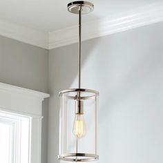 a light fixture hanging from the ceiling in a room