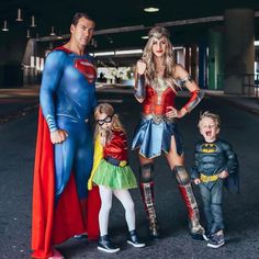 the family is dressed up as superman and wonder