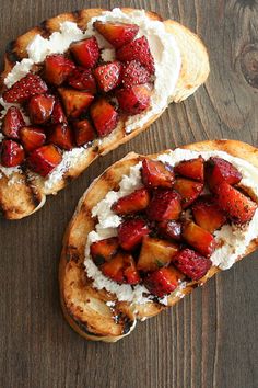 two pieces of bread with strawberries on top