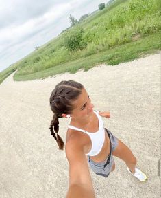 a young woman is running on the beach