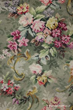 an area rug with flowers and vines on it