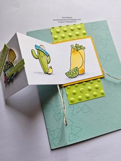 a close up of a small card with some type of paper on it and an object in the background