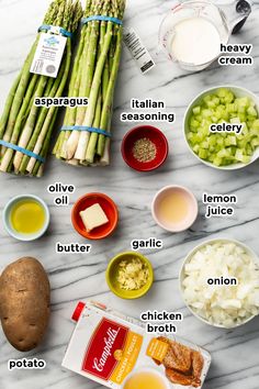 asparagus, broccoli, cheese, butter, and other ingredients on a marble counter top