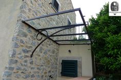 an outside view of a house with stone walls