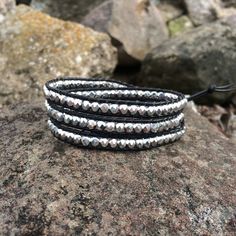 "This triple wrap beaded bracelet will look great with your favorite pair of jeans or your little black dress. Made with black leather cord, 4mm faceted silver Czech glass beads. It will fit a 6 1/2\"- 7 1/2\" wrist. You can send me your wrist measurement for a custom order at no extra charge." Adjustable Silver Wrap Bracelet For Festival, Silver Wrap Bracelet With Round Beads, Silver Beaded Bracelets With Black Beads For Festival, Silver Beaded Bracelets With Faceted Beads For Festivals, Adjustable Silver Wrap Bracelet With Silver Beads, Faceted Beads Wrap Bracelet For Festivals, Wrap Bracelet With Faceted Round Beads For Festival, Stackable Silver Wrap Bracelet With Round Beads, Wrap Bracelet With Faceted Beads For Festivals