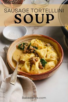 sausage tortellini soup in a bowl with a spoon and napkin on the side