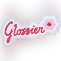 a close up of a sticker with the word glossier on it