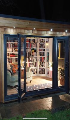 a room that has some kind of book shelf in it's corner with the doors open