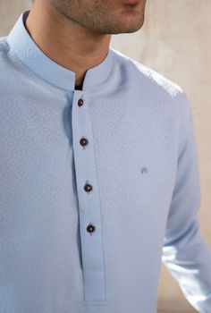 Color: Blue  Fabric: Organic Cotton  Includes:  -Kurta -Trouser -Kurta Trouser:  Breathable Soft Cotton with good fall.  -Mandarin collar  -Full Sleeves  -This is a 2 Piece Stitched Outfit Customize Stitching Available Traditional Blue Top For Eid, Casual Blue Kurta For Eid, Blue Casual Kurta For Eid, Traditional Long Sleeve Light Blue Kurta, Light Blue Long Sleeve Kurta With Dabka, Light Blue Long Sleeve Dabka Kurta, Blue Long Sleeve Sets With Dabka Detail, Formal Light Blue Sets For Eid, Light Blue Dabka Embellished Long Sleeve Kurta