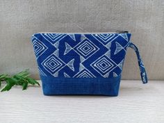 Boho Handmade Makeup Pouch Color: Blue and White Notes: The patterns on the pouch are not exactly the same due to the cut of the fabric. We will choose the pattern randomly for you, or if you want to select specifically, please send us a message !! Details: - The front and back of the pouch are made of cotton, dyed naturally into this indigo blue color. The tribal patterns are printed using block printing technique. - The size of the pouch makes it convenient for you to store makeups or small st Blue Pouch Cosmetic Bag For Daily Use, Blue Pouch Clutch For Daily Use, Blue Rectangular Cosmetic Bag For Daily Use, Blue Portable Pouch Cosmetic Bag, Portable Blue Pouch Cosmetic Bag, Blue Zipper Pouch For Daily Use, Blue Zipper Pouch Cosmetic Clutch Bag, Blue Zipper Pouch Clutch For Daily Use, Blue Zipper Clutch Cosmetic Bag