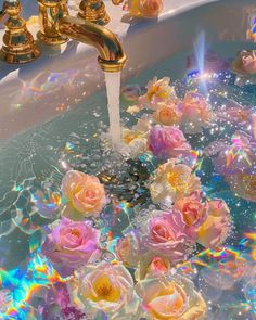 roses are being washed in a bathtub with soap bubbles on the bottom and gold faucets above them