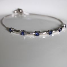 This sterling silver 3 mm Blue Sapphire Gemstone Bolo Bracelet is simply elegant. She'll love the versatility this bracelet offers as it pairs amazingly with fine fashion and casual wear. The bracelet is comfortable and easy to adjust to your liking with the pull tie and ball clasp. A thoughtful gift for a September Birthday and a variety of other occasions and events. Explore All Of Our Timeless Jewelry: https://www.etsy.com/shop/JOHNWESHDESIGNS All JohnWeshDesigns jewelry is handcrafted and de Classic Sterling Silver Birthstone Bracelets, Adjustable Fine Jewelry Bracelets With Stones, Fine Jewelry Bracelets With Stones, Classic Silver Bracelets With Birthstone, Classic Silver Bracelet With Birthstone, Classic Silver Birthstone Bracelets, Adjustable Sapphire Jewelry With Birthstone, Adjustable Silver Gemstone Tennis Bracelet, Adjustable White Gold Gemstone Bracelets