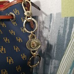 Dooney & Bourke Gold Plated 2 Part Turnlock Key Fob Bag Charm Keychain This Listing Is For The Key Fob Only, The Bag Is Not Included. You Are Seeing The Pictures Of The Key Fob I Have, But You Are Getting The Exact Same One, Only Brand New, Still Wrapped Up. Gold Plated Please Pay Attention To The Size As It Is On The Bigger Side This Is A Fun Key Fob/Bag Charm As The Turnlock Can Be Opened And The Key Fob Then Parted Into 2 As Shown In Pics. Great For Holding Your House Key Set And Your Car Key Luxury Bags With Key Leash, Gold Bags With Logo Charm, Brown Tote Bag, Brown Leather Shoulder Bag, Brown Tote, Leather Satchel Bag, Dooney & Bourke Bags, Monogram Prints, Tote Bag Purse