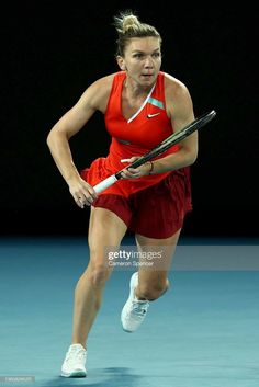 a female tennis player runs to hit the ball during a match at the australian open