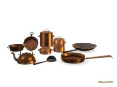 an assortment of copper colored pots and pans