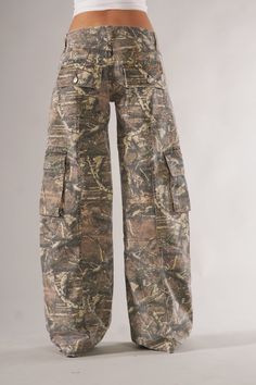 Introducing our Versatile Camo Cargo Pants, wrapped in a camouflaged design for those who appreciate a blend of style and practicality. Specifications: Size: Available in a range of sizes to ensure a comfortable fit for all customers. Material: Crafted from a durable blend of fabrics that withstand regular wear and maintain their form. Special Features: Equipped with multiple pockets, these pants offer practical storage space for essentials. Technical Specifications: The perfect cut provides eas