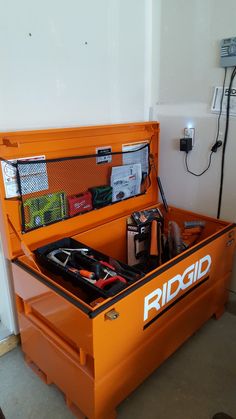 an orange tool box with tools in it