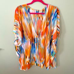 This Beach Cover-Up Is Brand New, Never Been Worn Or Washed. I Received As A Gift, It’s Beautiful But I Have Something Very Similar. It’s “One Size“ Fits All. The Colors Are Vibrant And Beautiful! No Tags Or Ever Attached. It Was Purchased Online. Bundle With Other Items In My Closet For Huge Savings! Casual Multicolor V-neck Cover-up, Summer Beachwear Tops With Multicolor Print, Summer Beachwear Tops In Multicolor Print, Multicolor Print Beachwear Top For Summer, Multicolor Tops For Brunch During Beach Season, Orange Tropical Tops For Spring, Tropical Orange Tops For Spring, Orange V-neck Cover-up For Spring, Spring Tropical Orange Tops