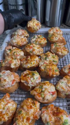 there are many muffins that have been placed on the cooling rack for baking