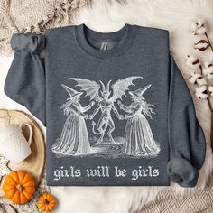 ✨ Celebrate spooky season season in style with our cozy vintage-inspired sweatshirts! Featuring an exclusive retro design printed with eco-friendly inks, these bestselling Gildan 18000 fleece-lined crewnecks offer a comfortable, roomy fit. Perfect for rocking oversized or paired with your favorite jeans for a chic, tucked-in look! ✨ SIZING * Please refer to the size chart in the pictures for exact measurements. * Better yet, simply lay out your favorite sweatshirt and measure it, comparing it to Fall Goblincore Crew Neck T-shirt, Vintage Halloween Long Sleeve Sweatshirt, Vintage Long Sleeve Halloween Sweatshirt, Goblincore Crew Neck T-shirt For Fall, Halloween Goblincore Crew Neck Top, Fall Goblincore Tops With Graphic Print, Fall Graphic Print Goblincore Tops, Halloween Band Merch Sweatshirt With Graphic Print, Halloween Band Merch Sweatshirt With Screen Print