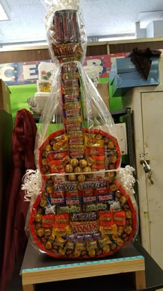 a guitar made out of candy and wrapped in plastic