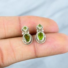 Genuine Peridot Stud Earrings, 925 Sterling Silver, Peridot Gemstone Studs, Handmade Peridot Jewelry, August Birthstone Studs, Gift For Her Product Details:- Product Weight: 2.80 gm ( Approx) Product Length :-  1.7 CM Gemstone Used: Peridot Metal Used: Solid 925 Sterling Silver Stamp Mark: 925 Metal Color: Shiny Silver Why To Wear Silver According to research, wearing silver has aided in balancing moods and increasing energy levels. The metal's inherent properties are believed to help in improvi Green Peridot Earrings For Anniversary, Green Sterling Silver Hallmarked Earrings, Silver Peridot Earrings For May Birthstone, Lime Green Peridot Gemstone Earrings, Green 925 Sterling Silver Earrings, Sterling Silver Earrings With Green Color Stamped 925, Green Sterling Silver Earrings Stamped 925, Peridot Jewelry, Peridot Earrings