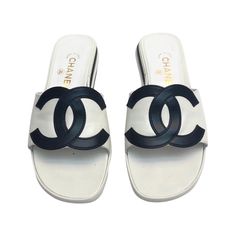 - Rare Chanel black and white leather sandals from the 90's collection. Featuring a big black interlocking CC logo. - Featuring two white and two black layers leather soles Craftsmanship is on point with a futuristic vibe and smooth shape from front to back, and vice versa. - European size 37.5. - Please note that It does not come with an original box and dust bag. If we do have any extra, we will send it together with the parcel. Chanel Open Shoes 2022, Brown Formal Shoes, Open Toe Sandals Heels, Italian Heels, Dior New Look, Logo Black And White, Chanel Black And White, Vintage Chanel Bag, Chanel Suit