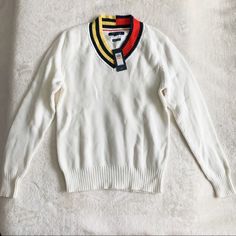 Perfect Unisex Sweater Top From Tommy Hilfiger Featuring Color Block Neck Line W/ Stripe Details 100% Cotton, Soft, Warm And Comfortable! White Long Sleeve V-neck Sweater With Ribbed Cuffs, White Knitted V-neck Sweater For Spring, White Fitted Sweater With Ribbed Collar, Classic White Sweater With Ribbed Cuffs, White V-neck Sweater With Ribbed Cuffs, White V-neck Sweater With Ribbed Collar, White V-neck Top With Ribbed Cuffs, Casual White V-neck Long Sleeve Sweater, Sporty White Sweater With Ribbed Collar