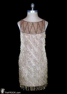 "BIG NEWS After 22 years, our website, TheFROCK.com, has had a makeover. Check out the new site, and join our mailing list for new arrivals.  Vintage Bob Mackie (undiffused main line label) 1980s sequin fringed metallic gold lace and silk chiffon dress. Lightweight, hidden rear zip. Measures bust 34\", waist 29\", length 35\". Condition is excellent. Our gilded Mackie was purchased at Christie's auction house and was featured modeled in their auction catalogue, that photo can be seen on page 11 Flapper Style Sequin Dress For Summer Party, Gatsby Style Beaded Flapper Dress For Party, Summer Flapper Style Sequin Party Dress, Summer Party Sequin Flapper Dress, 1920s Embellished Party Dress, 1920s Sleeveless Sequin Dress, 1920s Style Sequin Party Dress, Beaded Gatsby Flapper Dress For Evening, Beaded Gatsby Flapper Evening Dress