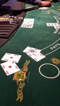 a casino table with cards and chips on it