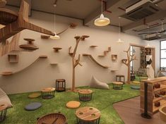 the interior of an office decorated in wood and artificial grass, with cat toys on the floor