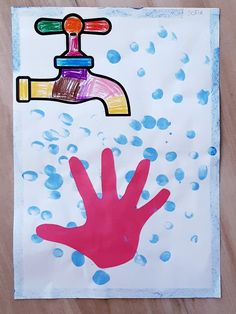 a child's handprint on a piece of paper with water drops and a faucet