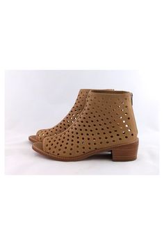 These modern booties have a perforated leather design with a chic open toe. They can be worn during the day with skinny jeans or dresses. Size 8.5 B Leather upper & sole Back zipper Open toe Perforated leather Stacked heel Light outsole wear Heel height 1.75" Trendy Leather Spring Booties, Leather Boots With Perforated Toe Box For Fall, Spring Leather Boots With Perforations, Casual Ankle Boots With Perforations, Spring Booties With Zipper Closure And Round Toe, Spring Booties Low Heel Medium Width, Spring Open Toe Boots With Zipper Closure, Spring Booties With Medium Width And Low Heel, Summer Leather Booties