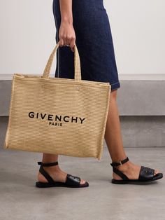 Woven from durable yet lightweight raffia, Givenchy's tote is perfect for trips to the beach. It's embroidered with the label's logo in black threads the front and has plenty of space inside to comfortably fit your wallet, water bottle, towel, sunscreen and a tablet. Chic Summer Bags With Embroidered Logo, Summer Beige Bag With Embroidered Logo, Beige Embroidered Logo Bag For Summer, Summer Shopping Bags With Embroidered Logo, Designer Summer Straw Bag For Daily Use, Designer Rectangular Straw Bag For Summer, Designer Straw Bag For Summer, Designer Straw Bag For Summer Shopping, Designer Summer Straw Shopping Bag