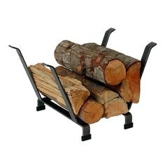 the log rack is holding two large pieces of tree trunks and has black metal legs