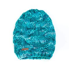 This cozy and incredibly soft woolen hat features an allover cable knit pattern. It is made from hand-dyed premium merino wool with a thick weave and rich texture featuring beautiful varied tones. A true winter essential! Knit by hand using luxurious 100% merino 19 micron wool Available in a variety colors to complement your wardrobe Optional detachable pom-pom Made in Santa Cruz, California One size fits most: Width: relaxed 15" fits head sizes up to 23" Length from top to bottom: excluding pom Cable Knit Pattern, Woolen Hat, Santa Cruz California, True Winter, Chunky Cable Knit, Felted Slippers, Wool Beanie, Women Shawl, Knitting Accessories