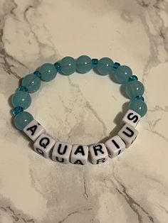 it is zodiac bracelet that has the color of that zodiac sign. Spiritual Zodiac Sign Bracelet Gift, Symbolic Friendship Bracelets With Round Beads, Adjustable Zodiac Sign Bracelet As Gift, Adjustable Zodiac Sign Bracelets As Gift, Adjustable Spiritual Zodiac Jewelry, Symbolic Zodiac Sign Bracelet Jewelry, Apple Watch Bands Fashion, Men's Earrings, Bracelet Inspo